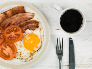 Bacon Egg and Tomato Breakfast Food With a Mug of Black Coffee