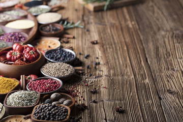 Obraz na płótnie Canvas various dry spices on a wooden table