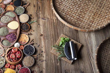 various dry spices on a wooden table