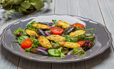 Fresh vegetable salad, healthy food, organic cucumbers,
mussels, tomatoes and salad leaves