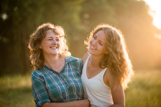 Mature woman with her teenage daughter enjoying outdoors