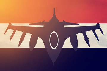 the fighter plane of the armed forces on the background of the flag of Yemen