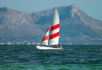 Fototapeta premium Sailing yacht in the sea bay.
