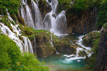 Massive waterfall among lush foliage