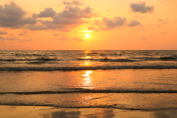 Fototapeta na wymiar Sunset on the beach. Koh Chang island, Thailand. Romantic feeling. Golden sun and sky.