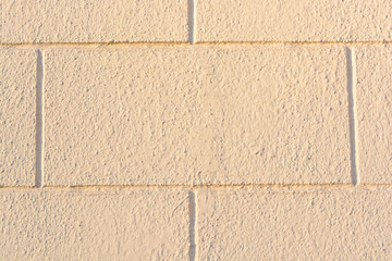 Beige brick wall background texture