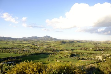 Fototapeta na wymiar Green landscape of Stavrovouni mountain and cloudy sky