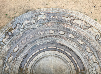 Sandakada pahana or Moon stone at the entrance of old buddhist temple in Anuradhapura, Sri Lanka