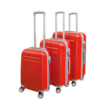 Three suitcases isolated on white background. Polycarbonate suitcases isolated on white. Red suitcases.
