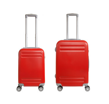 Two suitcases isolated on white background. Polycarbonate suitcases isolated on white. Red suitcases.