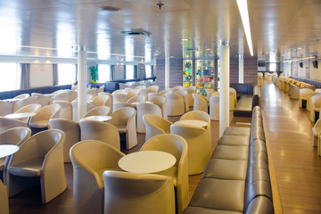 ferry inside. Empty seats without passengers.
 