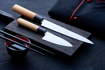 Asian kitchen chef accessories on black stone table