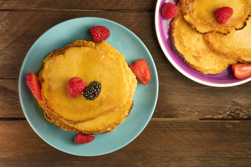 Freshly baked homemade pancakes with fresh fruit
