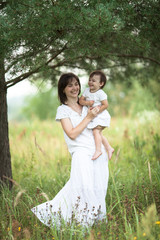 Fototapeta premium emotional mother with daughter in arms, motherhood