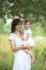 emotional mother with daughter in arms, motherhood