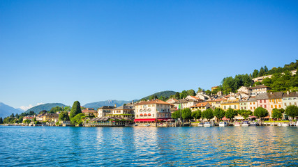 Naklejka premium View of Motta square on Orta San Giulio from a touristic boat, Lake Orta, Piedmont, Italy