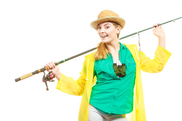 Woman with fishing rod, spinning equipment