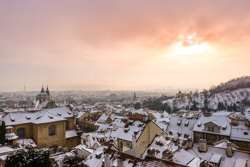 View of Prague under the snow at sunset