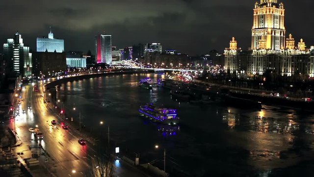 view of the hotel Ukraine (Radisson Royal Hotel), Government Building, and Moskva River in Moscow evening