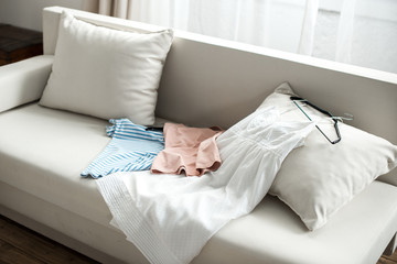 Clothes lying on sofa