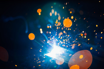 artistic welding sparks light, industrial background
