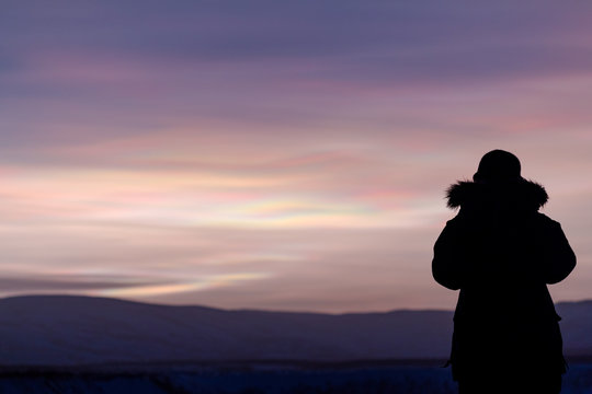 Person contemplates an arctic sunset
