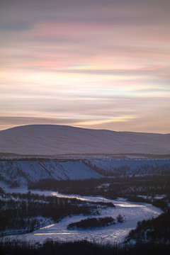 A polar cloudscape over an arctic river