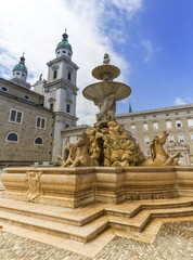 Fototapeta premium Fountain and cathedral at the Residenzplatz in Salzburg, Austria