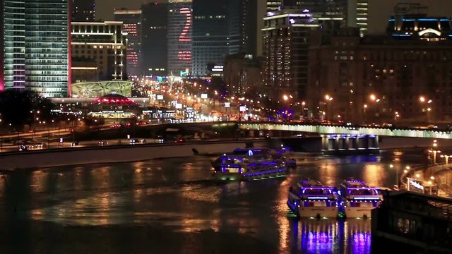 Night streets of Moscow in the spring. View of the building of Novy Arbat Street and the building of the Moscow City Hall