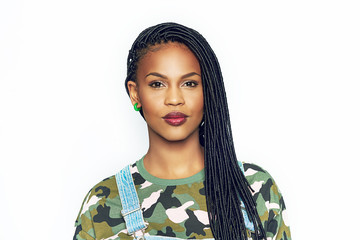 Pretty African woman with braided hair and makeup - obrazy, fototapety, plakaty