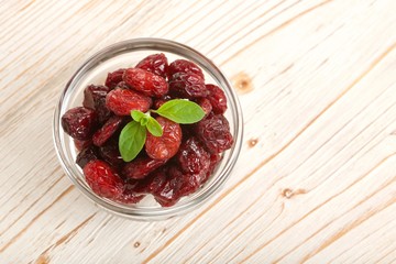 dried cranberries on a wooden background