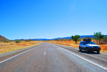 Car on the side of the road in the outback, Australia.