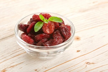 dried cranberries on a wooden background