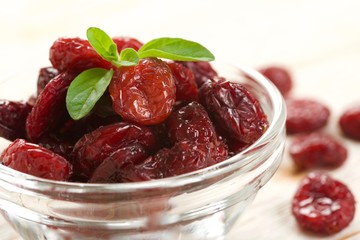 dried cranberries on a wooden background