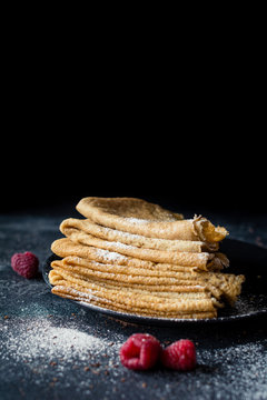 Vegan Pancakes, Russian Pancakes Or Crepes On Black Plate. Selective Focus, Copy Space