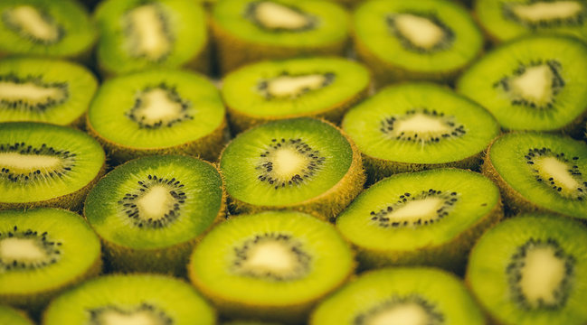 Many slices of kiwi fruit. Healthy food background