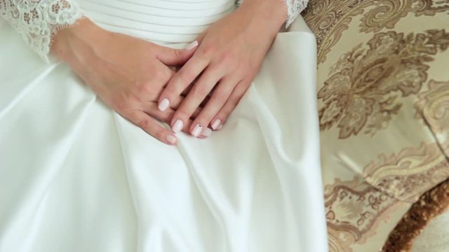 the bride's hands with manicure