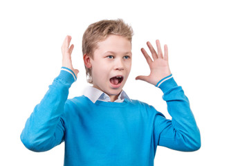 Screaming young boy in blue pullover in surprised pose. Schoolboy with pancil isolated on white background.