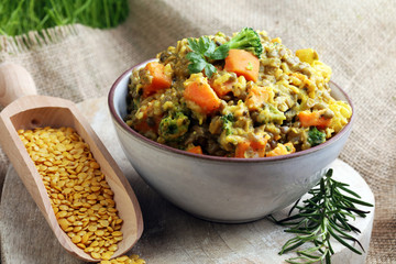 Lentil curry with carrot, cauliflower, broccoli and onion in a bowl. Healthy lifestyle. Diet menu
