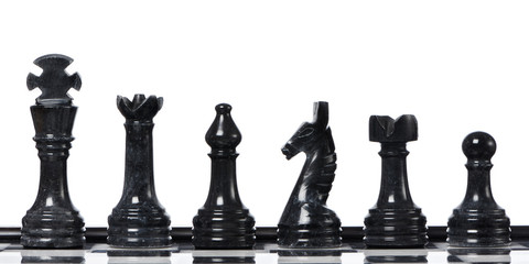 Black chessmen on chessboard