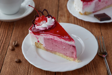 Delicious cake dessert with cream, cherry and coffee