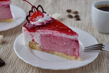 Delicious cake dessert with cream, cherry and coffee