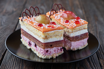 Delicious cake dessert with cream and fruit