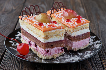 Delicious cake dessert with cream and fruit