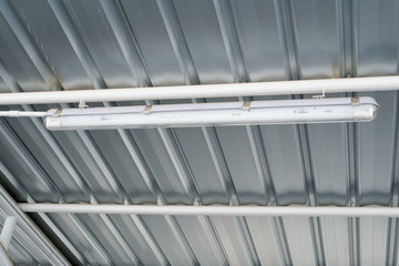 Fluorescent lamp under metal sheet roof
