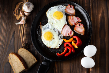 Fried eggs in a frying pan in a rural