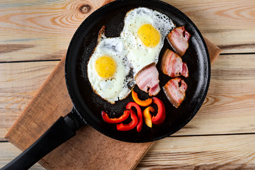 Fried eggs in a frying pan in a rural