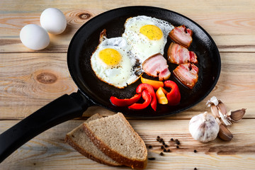 Fried eggs in a frying pan in a rural