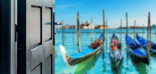Opened door concept to beautiful and imaginary venice landscape