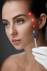 Beauty Injection. Beautiful Girl Face With Laser Points On Skin